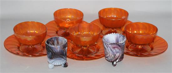 A set of 5 orange Venetian jelly glasses, stands and pair slag glass candle holders